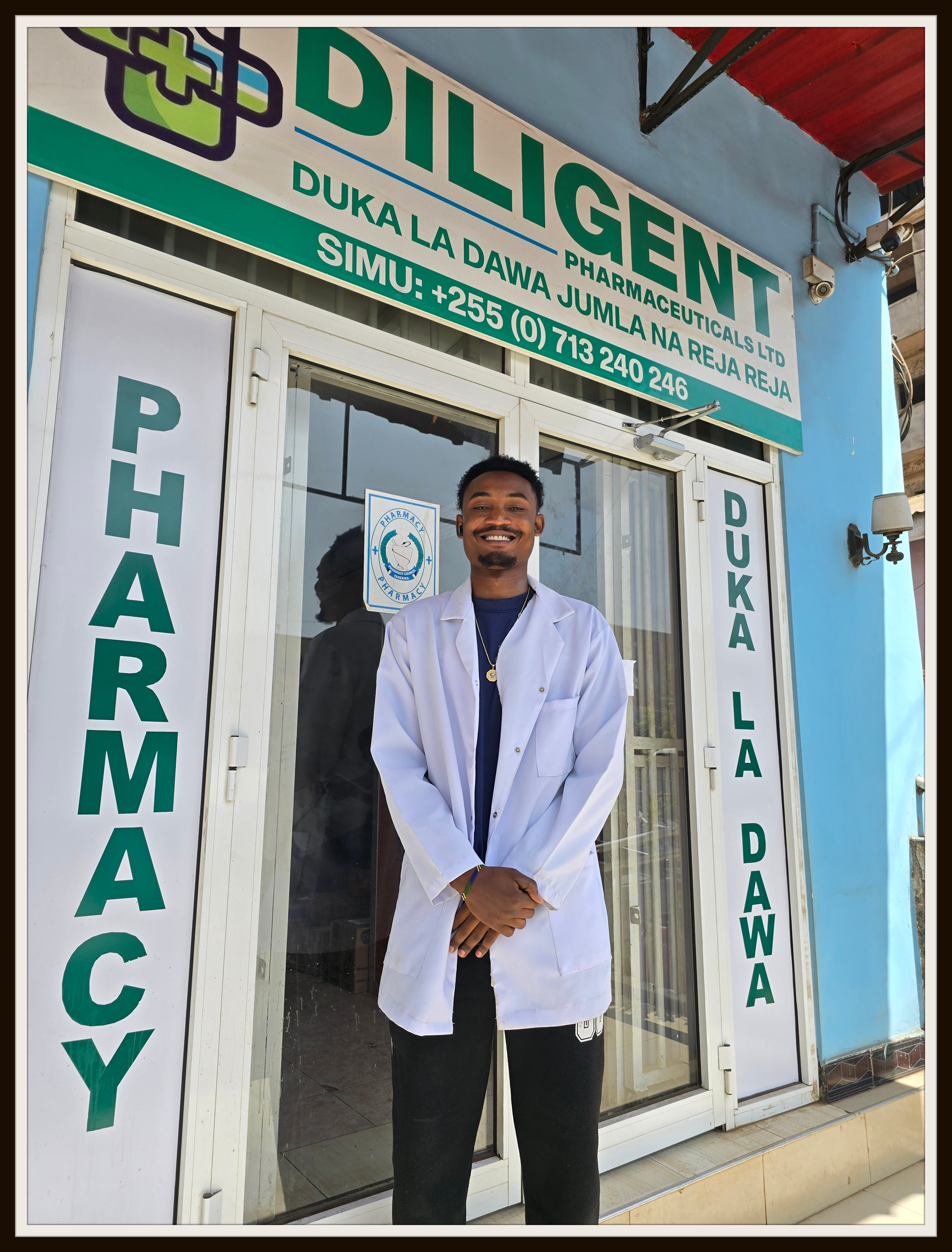 Kipson in front of his workplace
